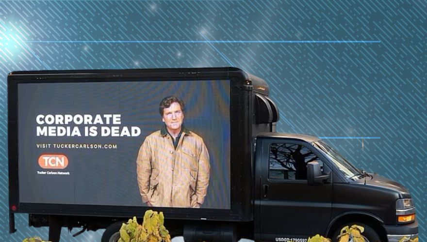 Tucker Carlson Network Parks Billboard Trucks Saying ‘Corporate Media is Dead’ Outside CNN, NYT, WaPo, and NBC